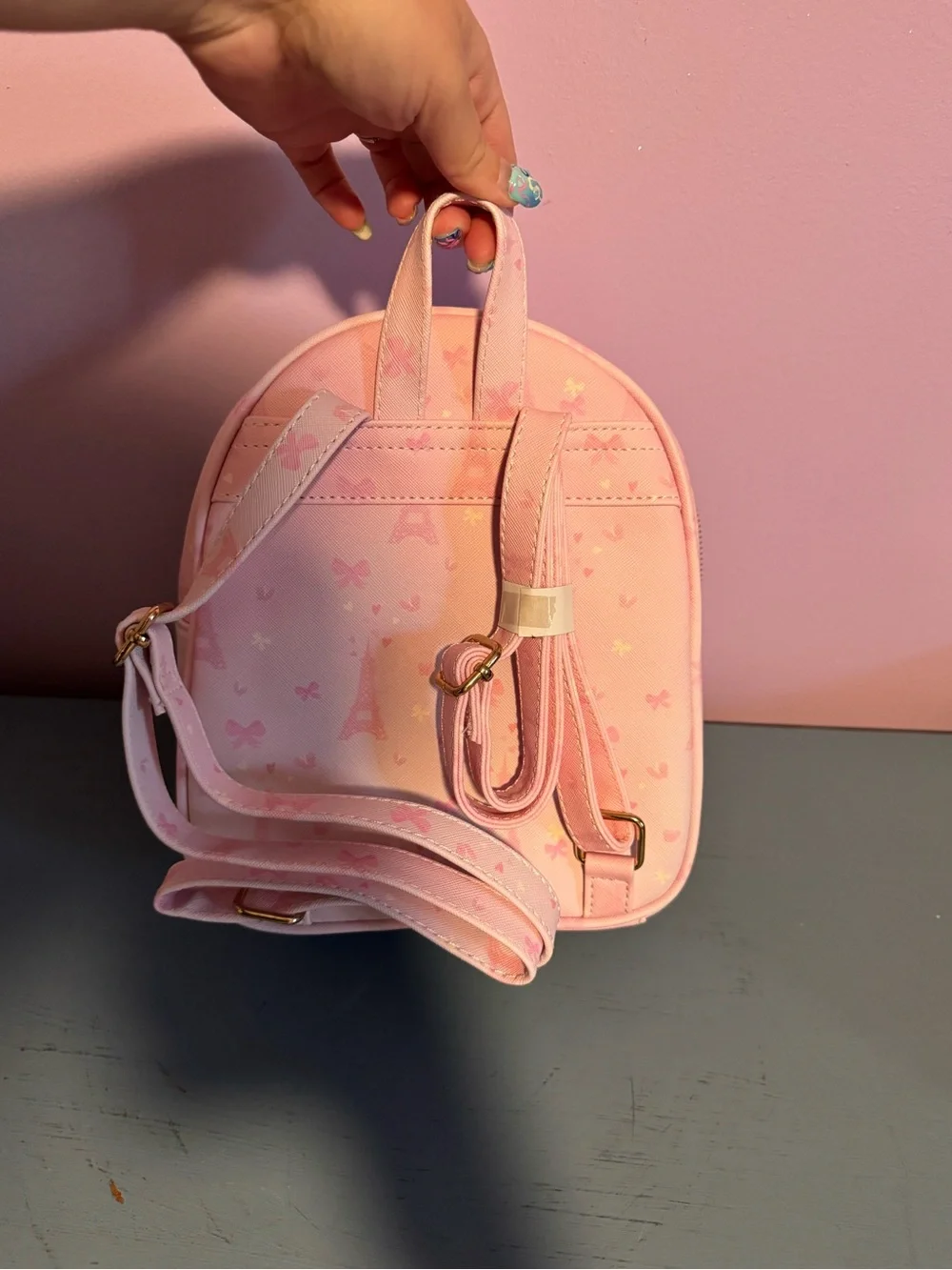 Under One Sky Pink Mini Backpack with Gold Charm Chain & Pom Pom